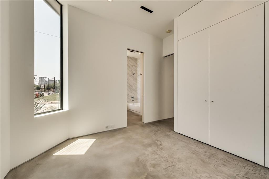 1504 Burlew Street, Unit 4 Dallas, TX 75204 - Photo 21 of 30 a view of an empty room with a window