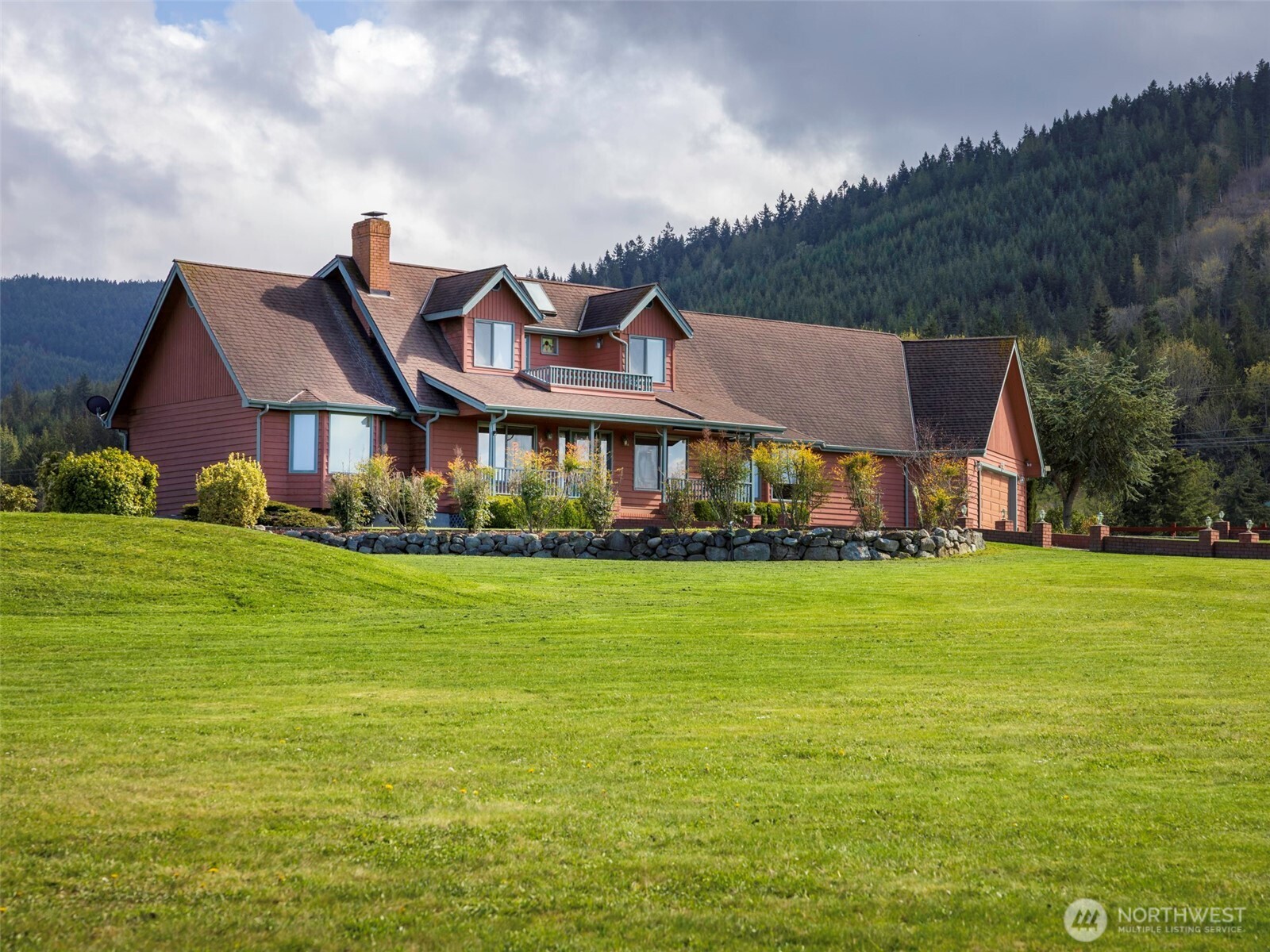2594 Happy Valley Road Sequim, WA 98382 - Photo 1 of 35 a front view of house with yard and seating