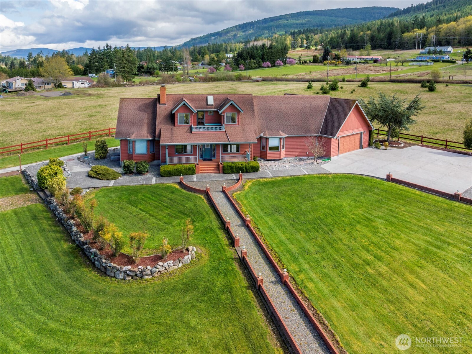 2594 Happy Valley Road Sequim, WA 98382 - Photo 2 of 35 an aerial view of a house with outdoor space and a lake view