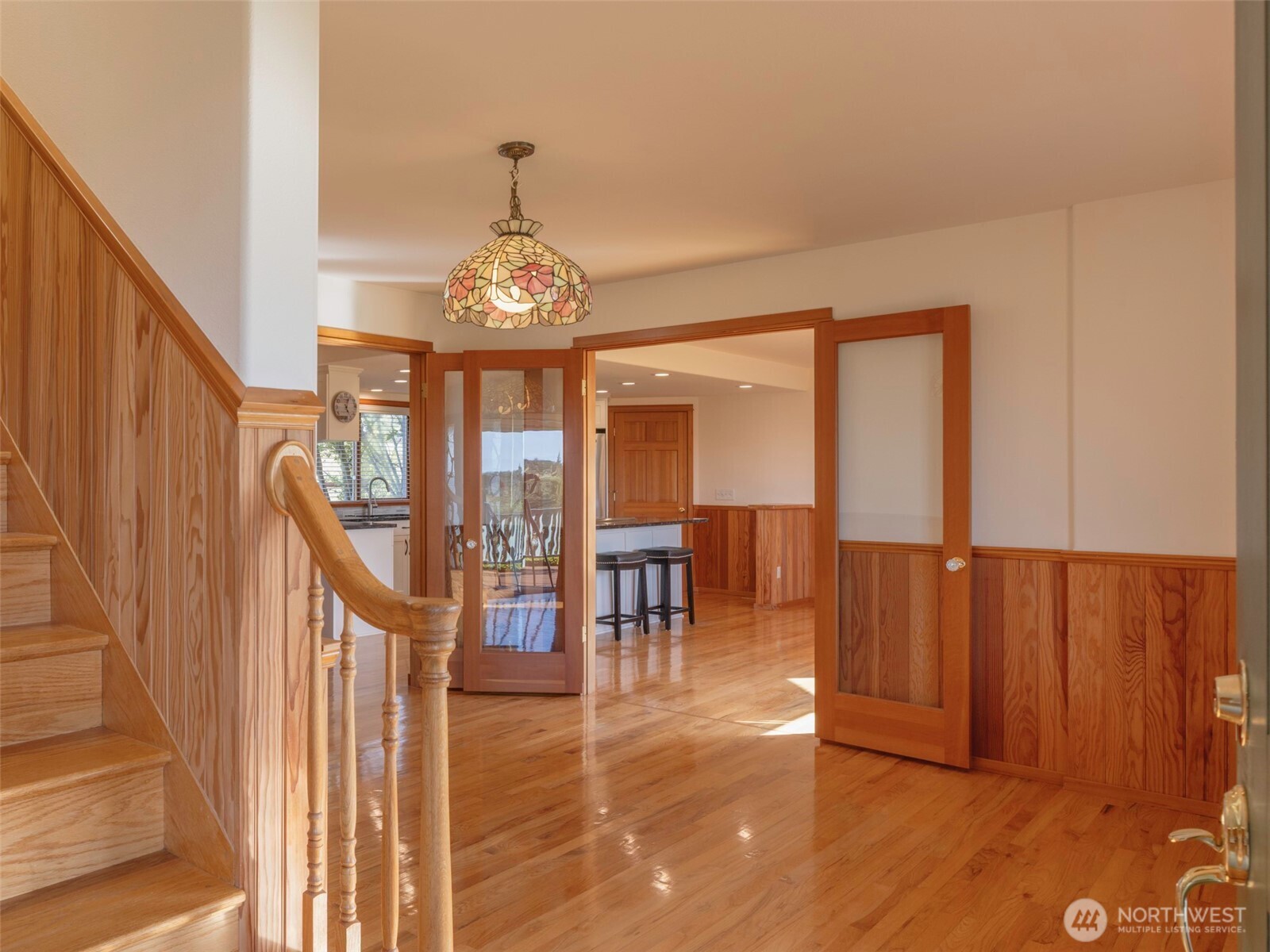 2594 Happy Valley Road Sequim, WA 98382 - Photo 22 of 35 a view of a livingroom with furniture wooden floor staircase and front door