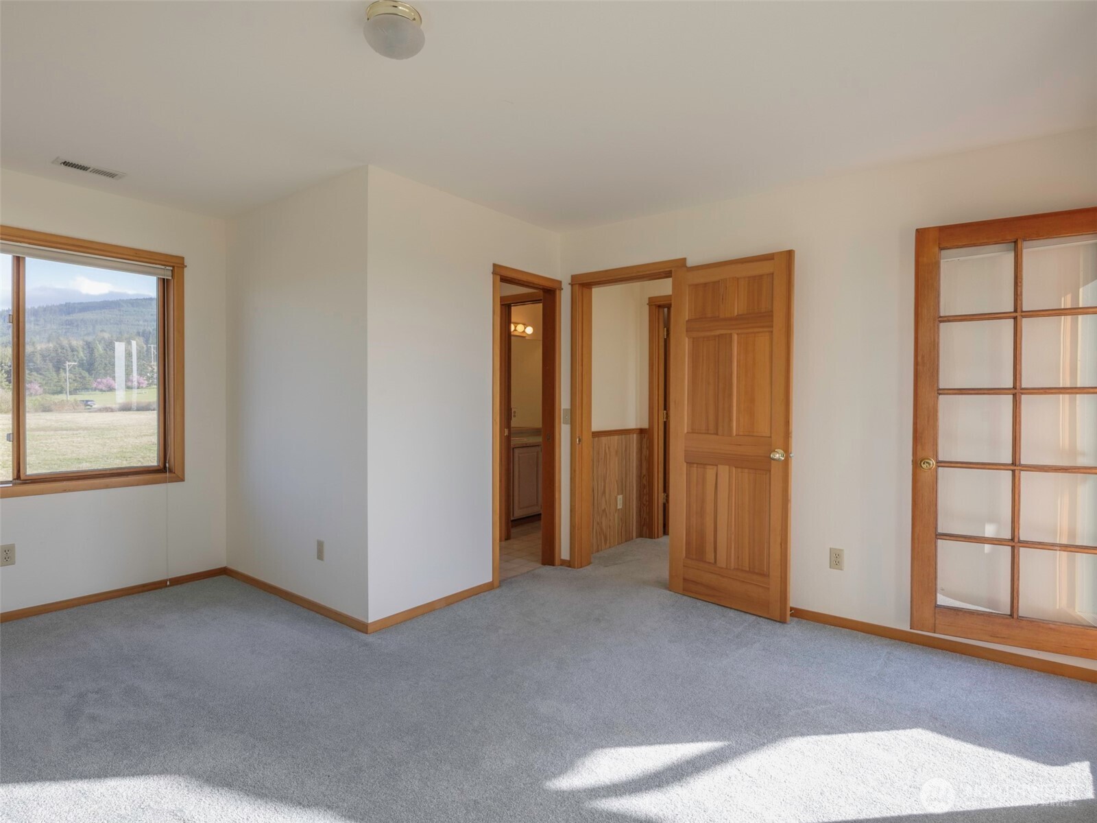 2594 Happy Valley Road Sequim, WA 98382 - Photo 24 of 35 a view of an empty room with a window
