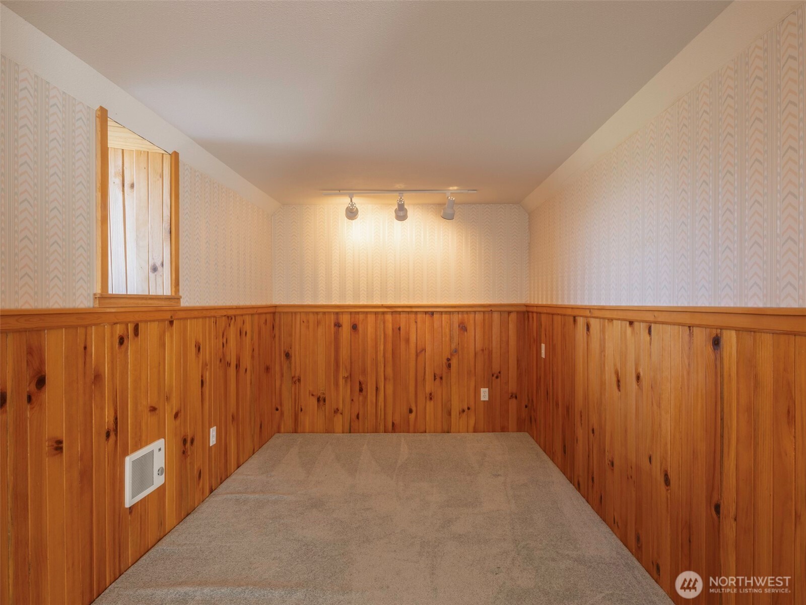 2594 Happy Valley Road Sequim, WA 98382 - Photo 27 of 35 en empty room with wooden walls