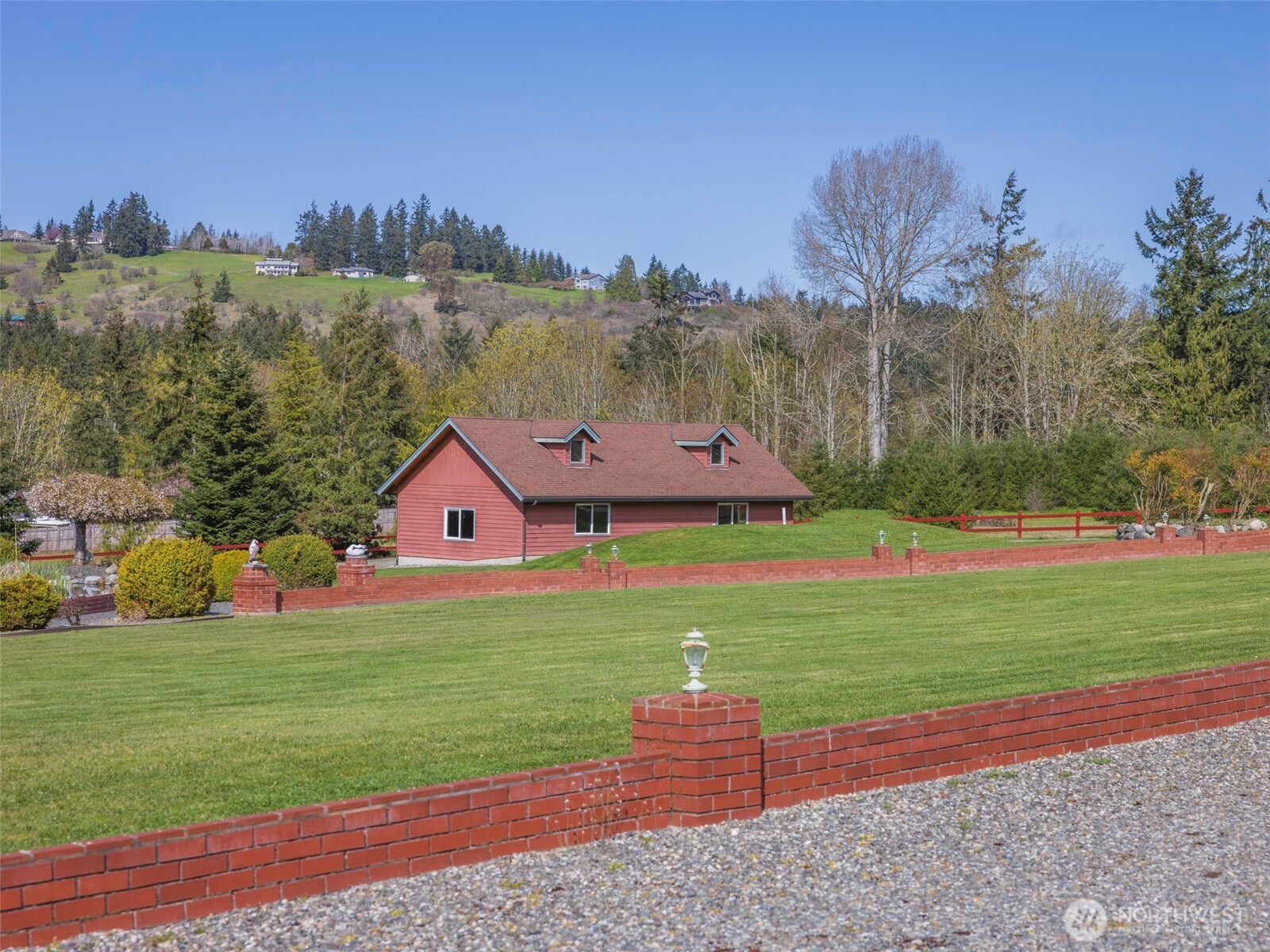 2594 Happy Valley Road Sequim, WA 98382 - Photo 30 of 35 a front view of a house with a yard and garage