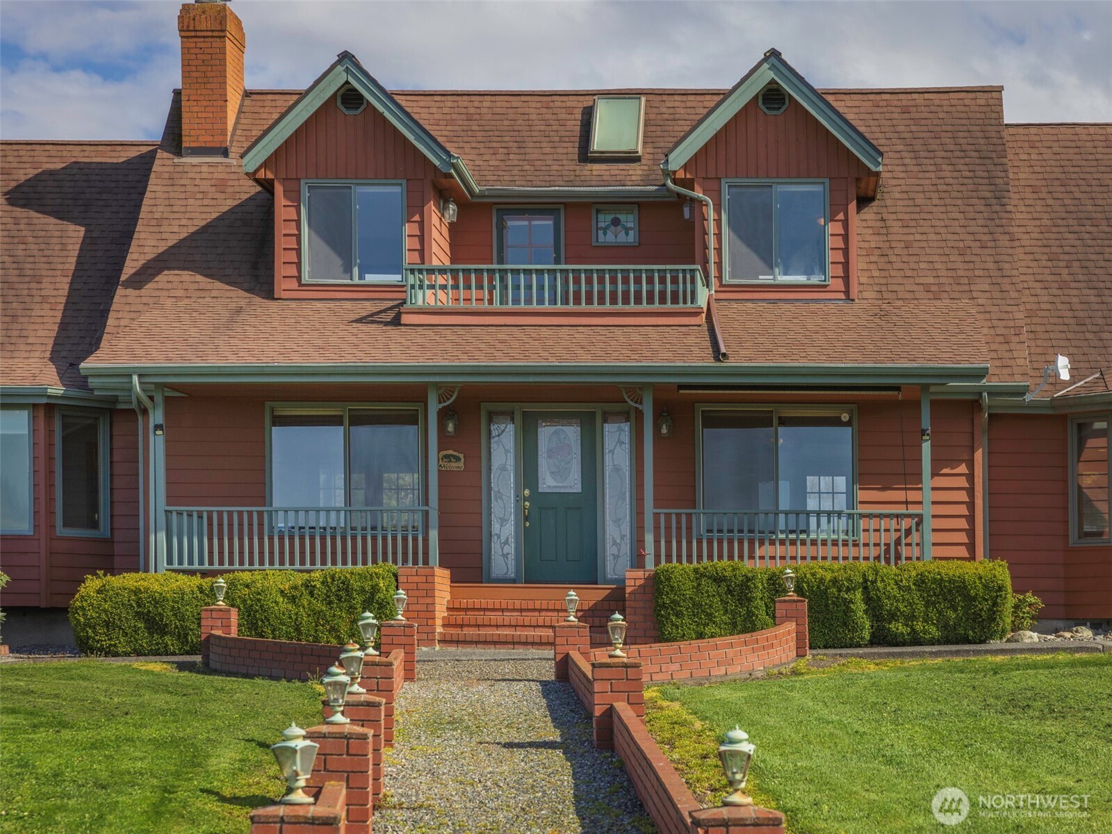 2594 Happy Valley Road Sequim, WA 98382 - Photo 4 of 35 a front view of a house with a yard