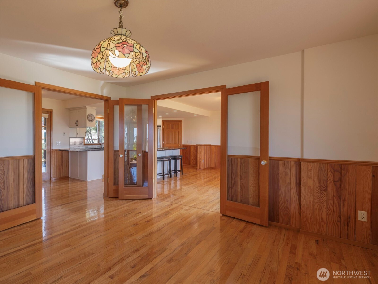 2594 Happy Valley Road Sequim, WA 98382 - Photo 8 of 35 a view of a room with wooden floor water heater and chairs