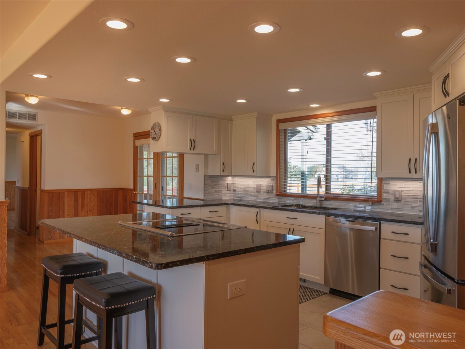 2594 Happy Valley Road Sequim, WA 98382 - Photo 10 of 35 a kitchen with kitchen island granite countertop a sink and counter space