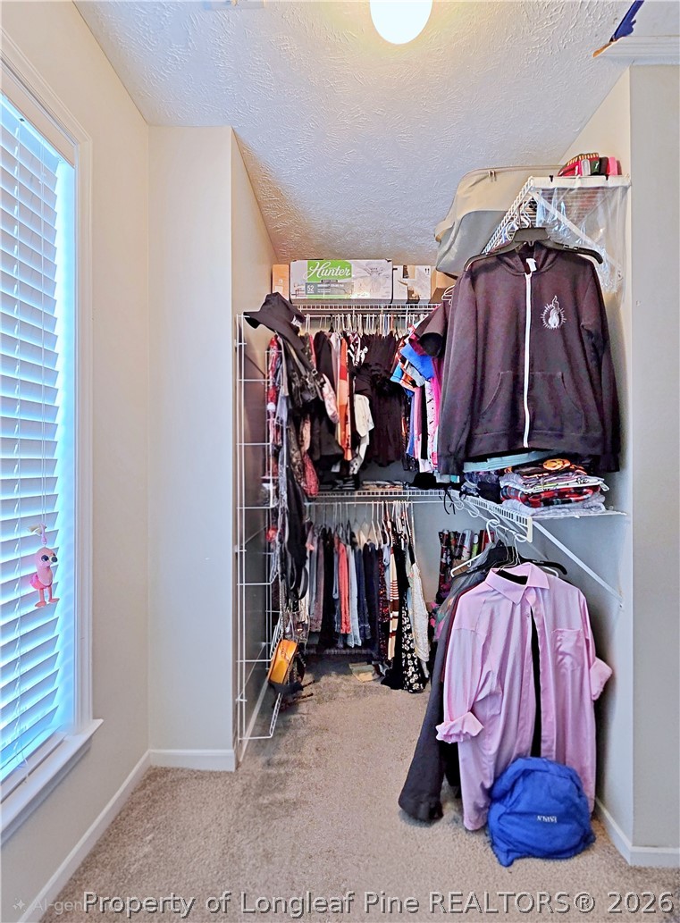 5218 Pringle Way Hope Mills, NC 28348 - Photo 24 of 43 a view of walk in closet with clothes