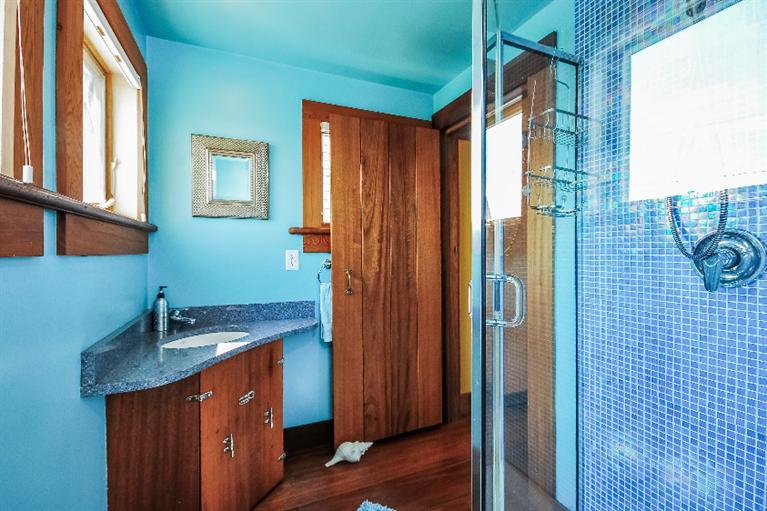 26 Short Beach Road Centerville, MA 02632 - Photo 12 of 34 a bathroom with a sink and a mirror