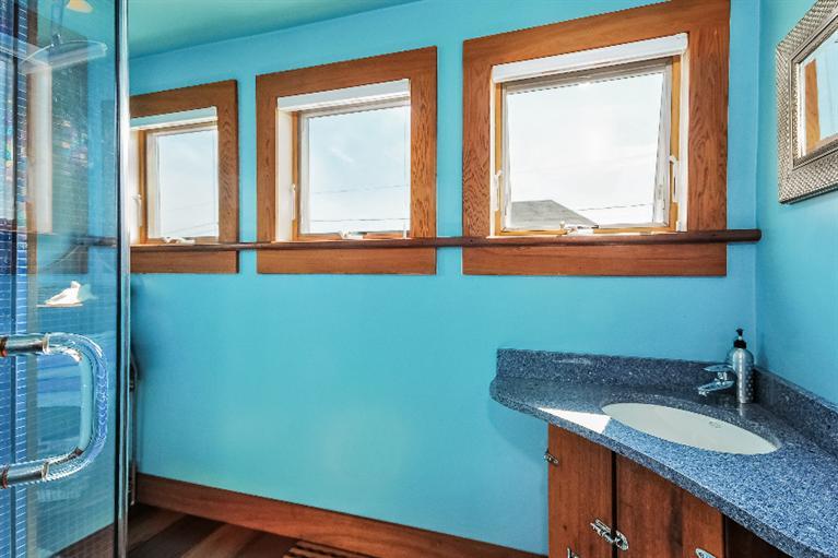 26 Short Beach Road Centerville, MA 02632 - Photo 13 of 34 a bathroom with a granite countertop sink and a window