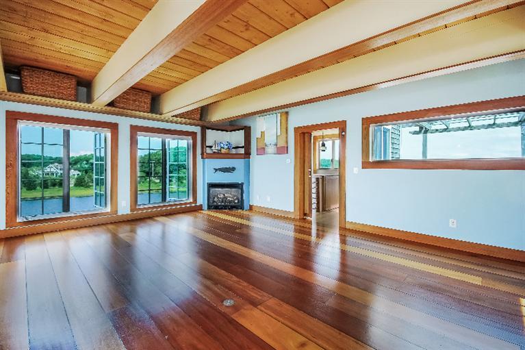 26 Short Beach Road Centerville, MA 02632 - Photo 17 of 34 a view of an empty room with wooden floor and a window