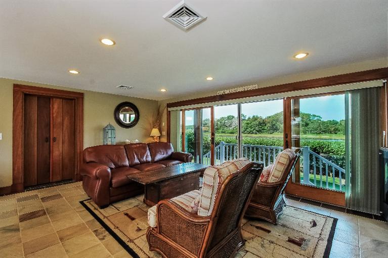 26 Short Beach Road Centerville, MA 02632 - Photo 21 of 34 a living room with furniture and a large window