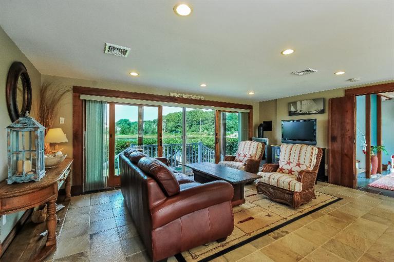 26 Short Beach Road Centerville, MA 02632 - Photo 22 of 34 a living room with furniture and a flat screen tv