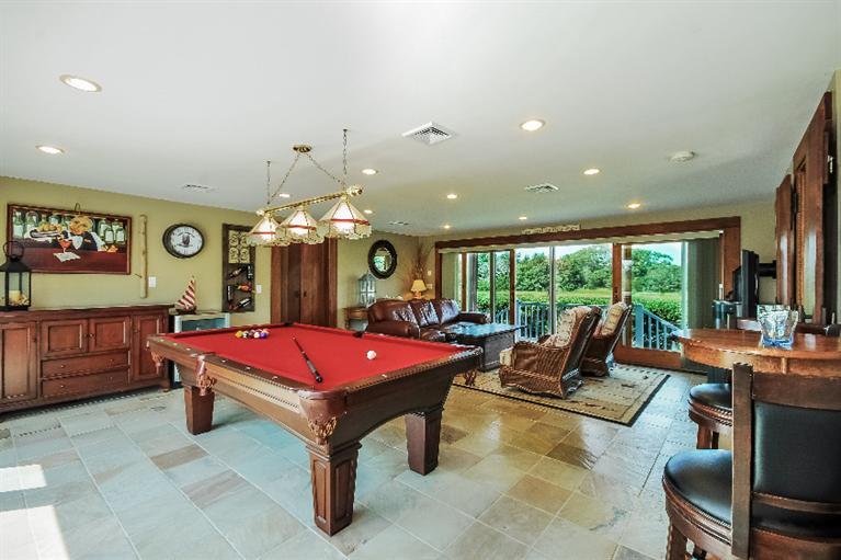 26 Short Beach Road Centerville, MA 02632 - Photo 23 of 34 a living room with furniture pool table and a large window