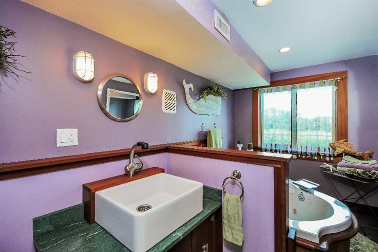 26 Short Beach Road Centerville, MA 02632 - Photo 25 of 34 a bathroom with a sink and a large mirror