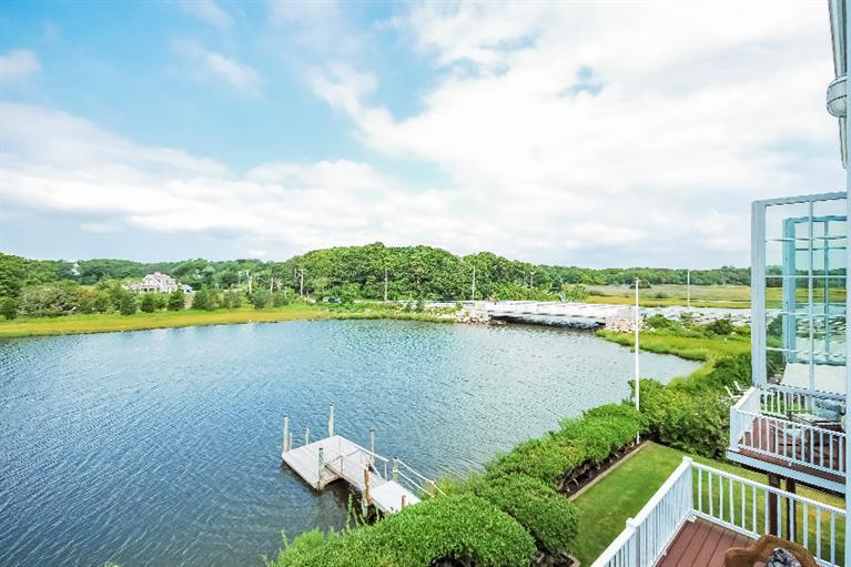 26 Short Beach Road Centerville, MA 02632 - Photo 27 of 34 a view of a lake with a city view