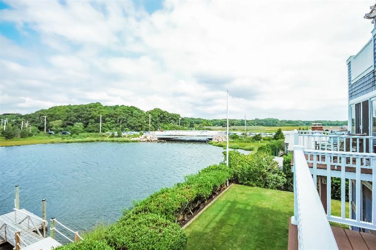 26 Short Beach Road Centerville, MA 02632 - Photo 28 of 34 a view of a lake with houses in the back