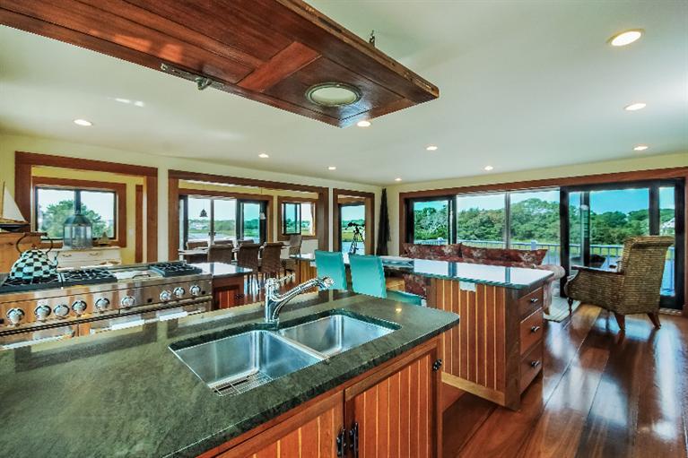 26 Short Beach Road Centerville, MA 02632 - Photo 10 of 34 a kitchen with a large window and dining table