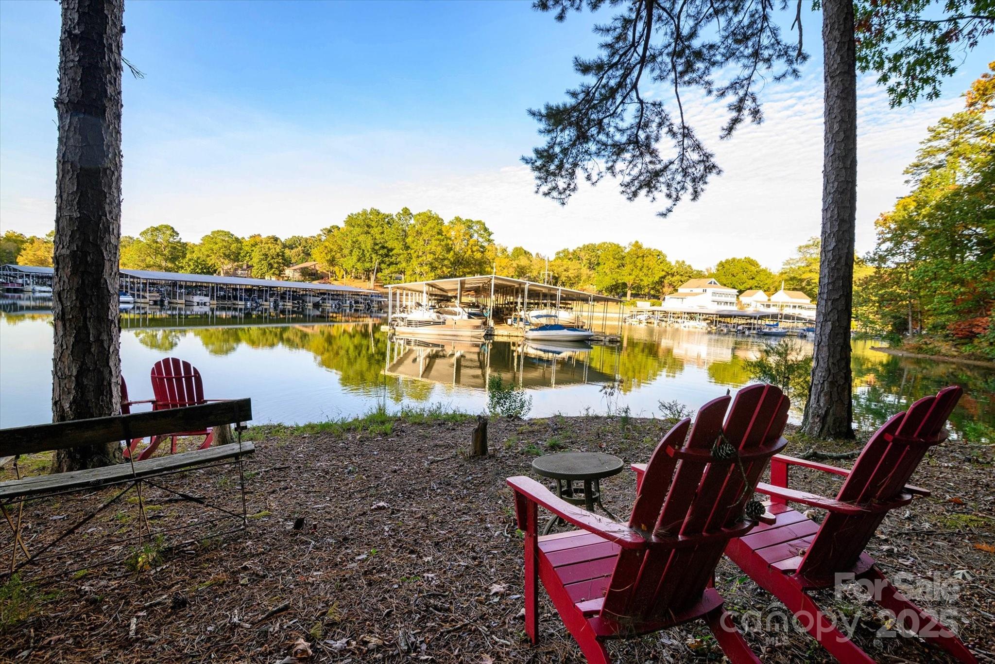 212 Riverview Terrace Clover, SC 29710 - Photo 12 of 48 a view of a lake with couches in the patio