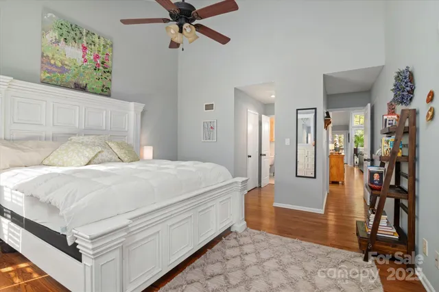 a bedroom with a bed and a book shelf