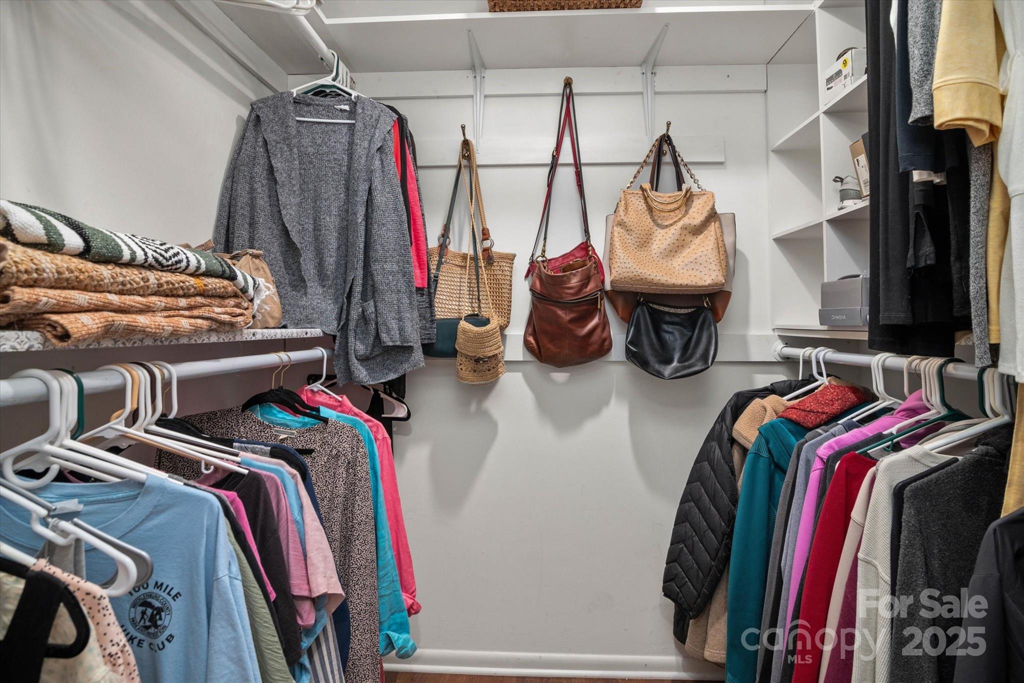 212 Riverview Terrace Clover, SC 29710 - Photo 27 of 48 a view of walk in closet with clothes and shoes