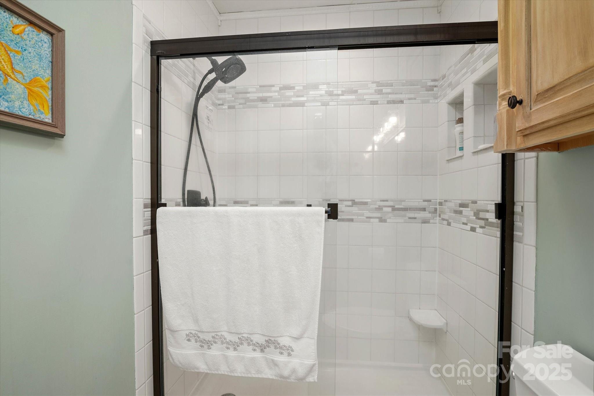 212 Riverview Terrace Clover, SC 29710 - Photo 29 of 48 a bathroom with a glass shower door