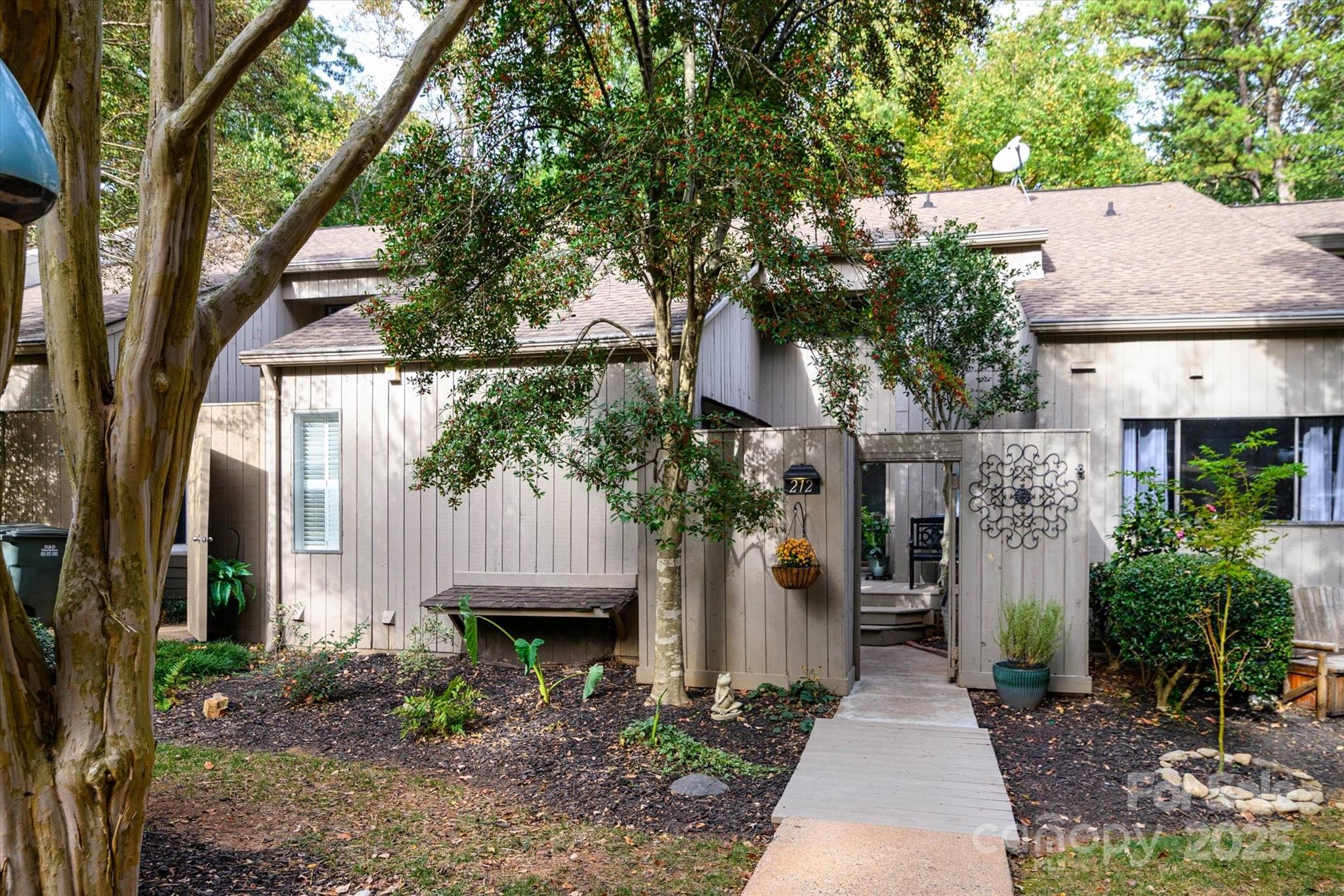 212 Riverview Terrace Clover, SC 29710 - Photo 3 of 48 a front view of a house with garden