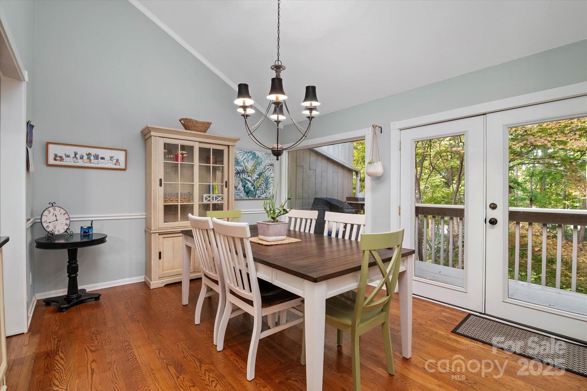212 Riverview Terrace Clover, SC 29710 - Photo 35 of 48 a view of a dining room with furniture wooden floor and chandelier