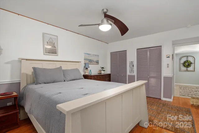 a bedroom with a bed and a chair