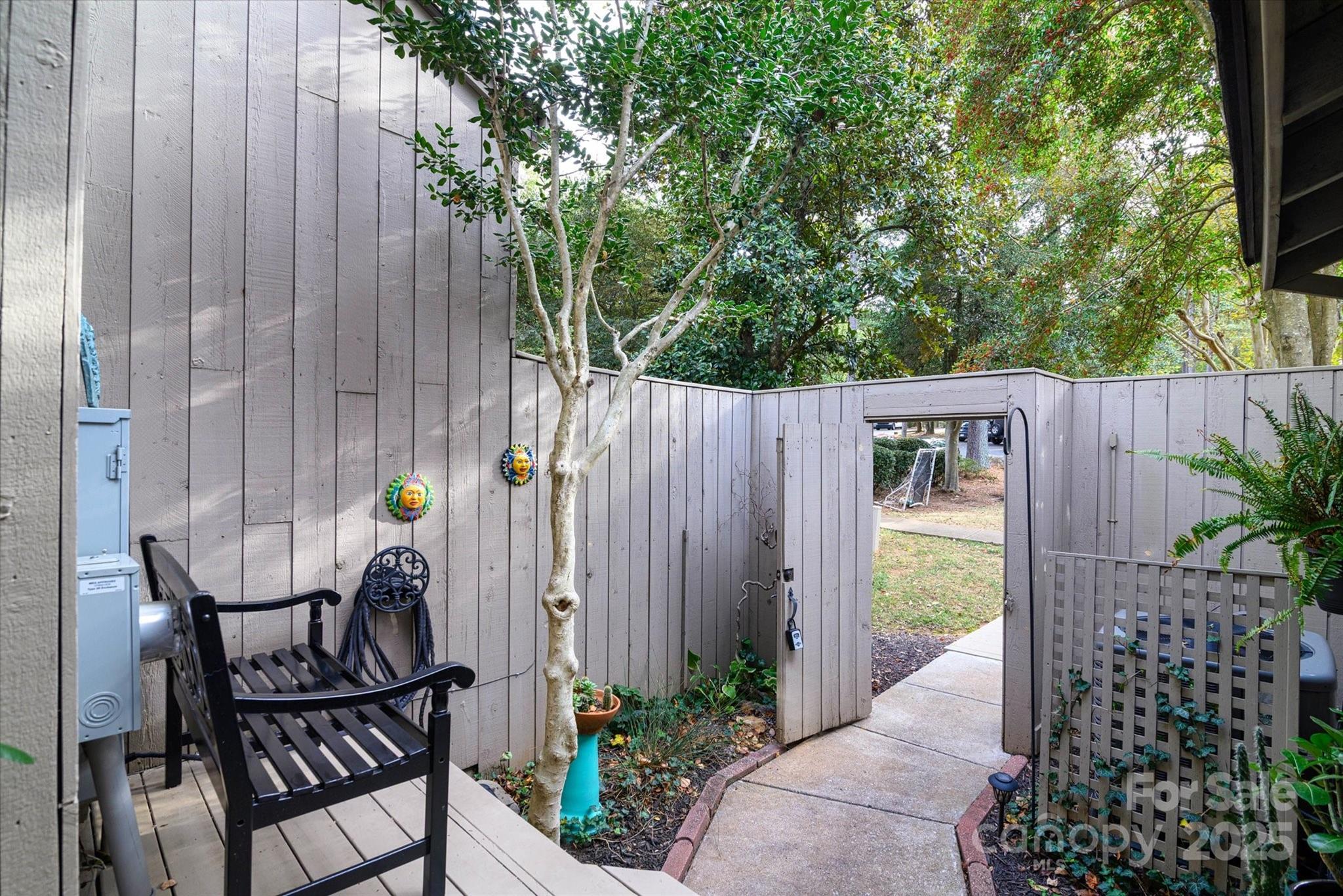 212 Riverview Terrace Clover, SC 29710 - Photo 5 of 48 a backyard view with sitting space and garden