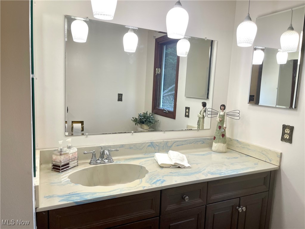 6518 Stonecreek Road Southwest Newcomerstown, OH 43832 - Photo 12 of 42 Bathroom featuring vanity on the first floor