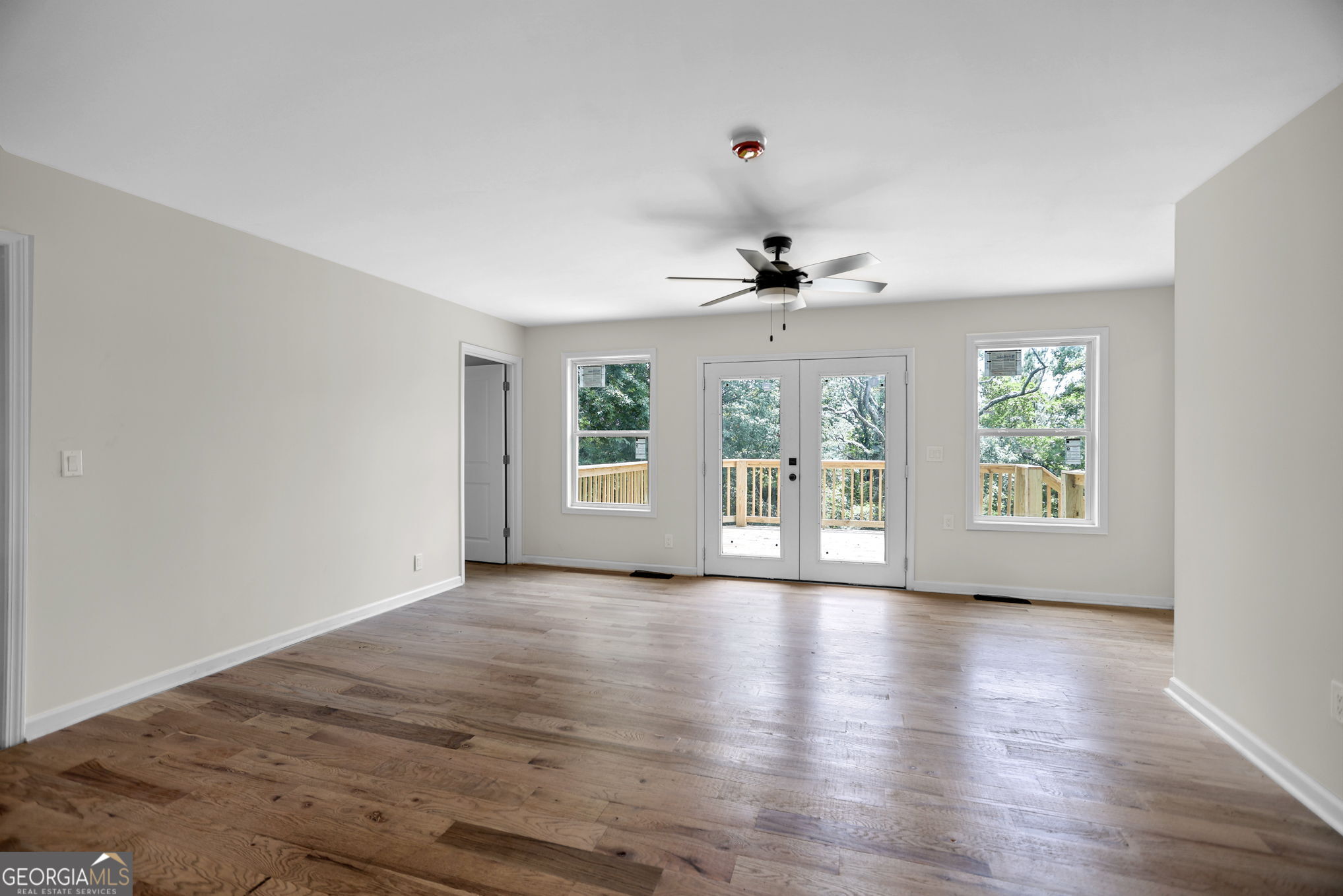 7060 Scenic Heights Road Manchester, GA 31816 - Photo 25 of 52 a view of an empty room with a window and wooden floor