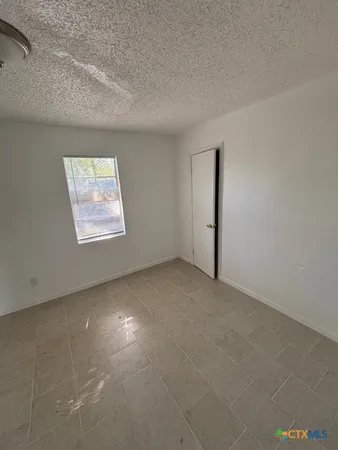 a view of a backyard with a garden