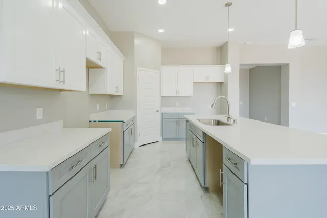 a kitchen with a sink stove and refrigerator