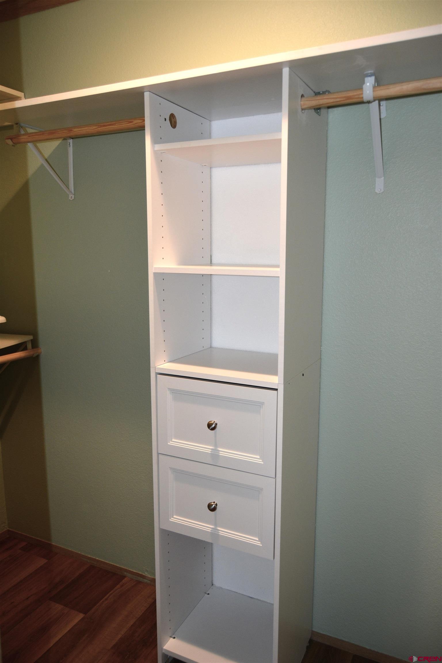 901 6530 Road, Unit 1030 Montrose, CO 81401 - Photo 14 of 22 a bathroom with a shower curtain and sink