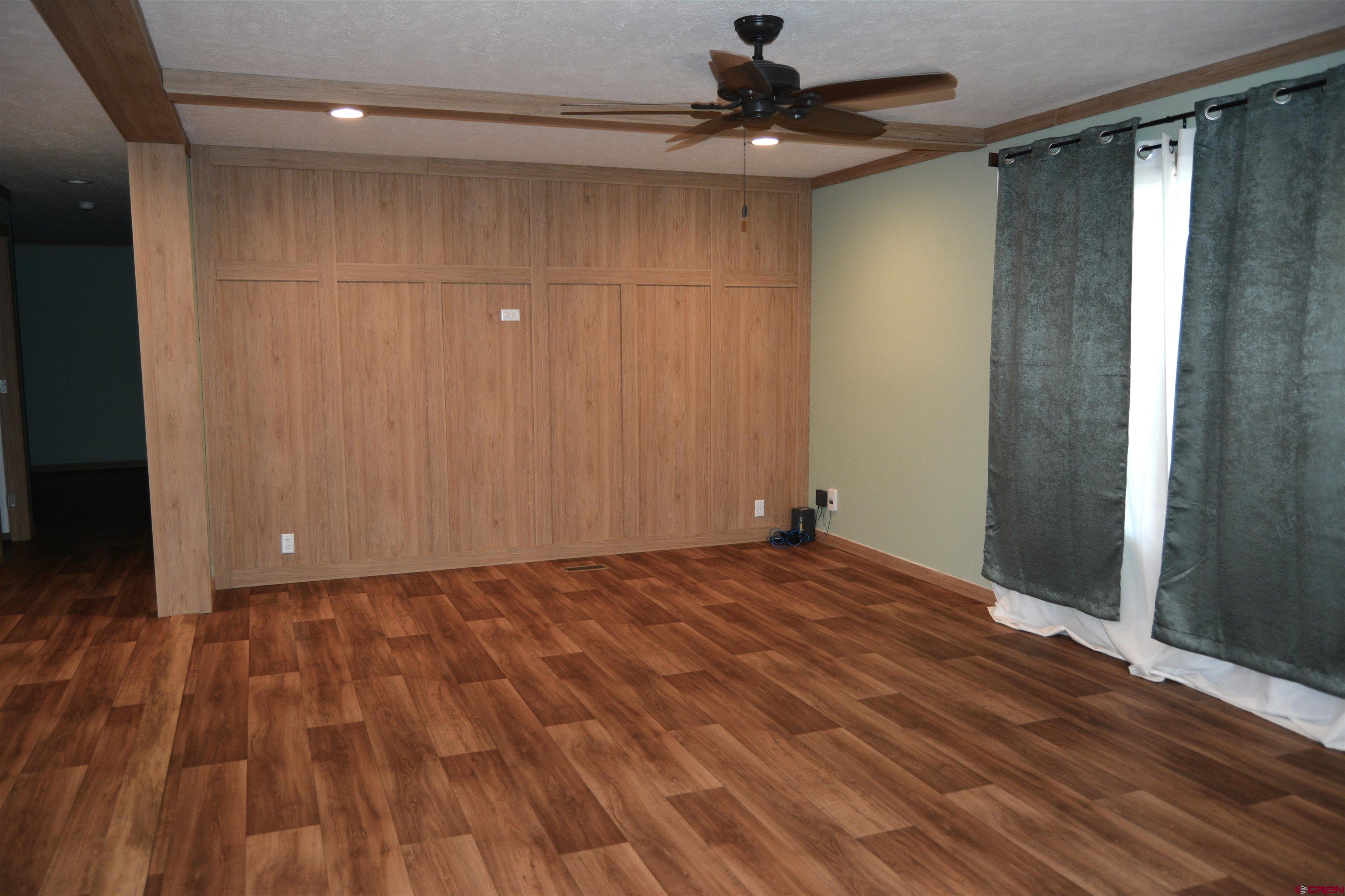 901 6530 Road, Unit 1030 Montrose, CO 81401 - Photo 15 of 22 a view of empty room with wooden floor