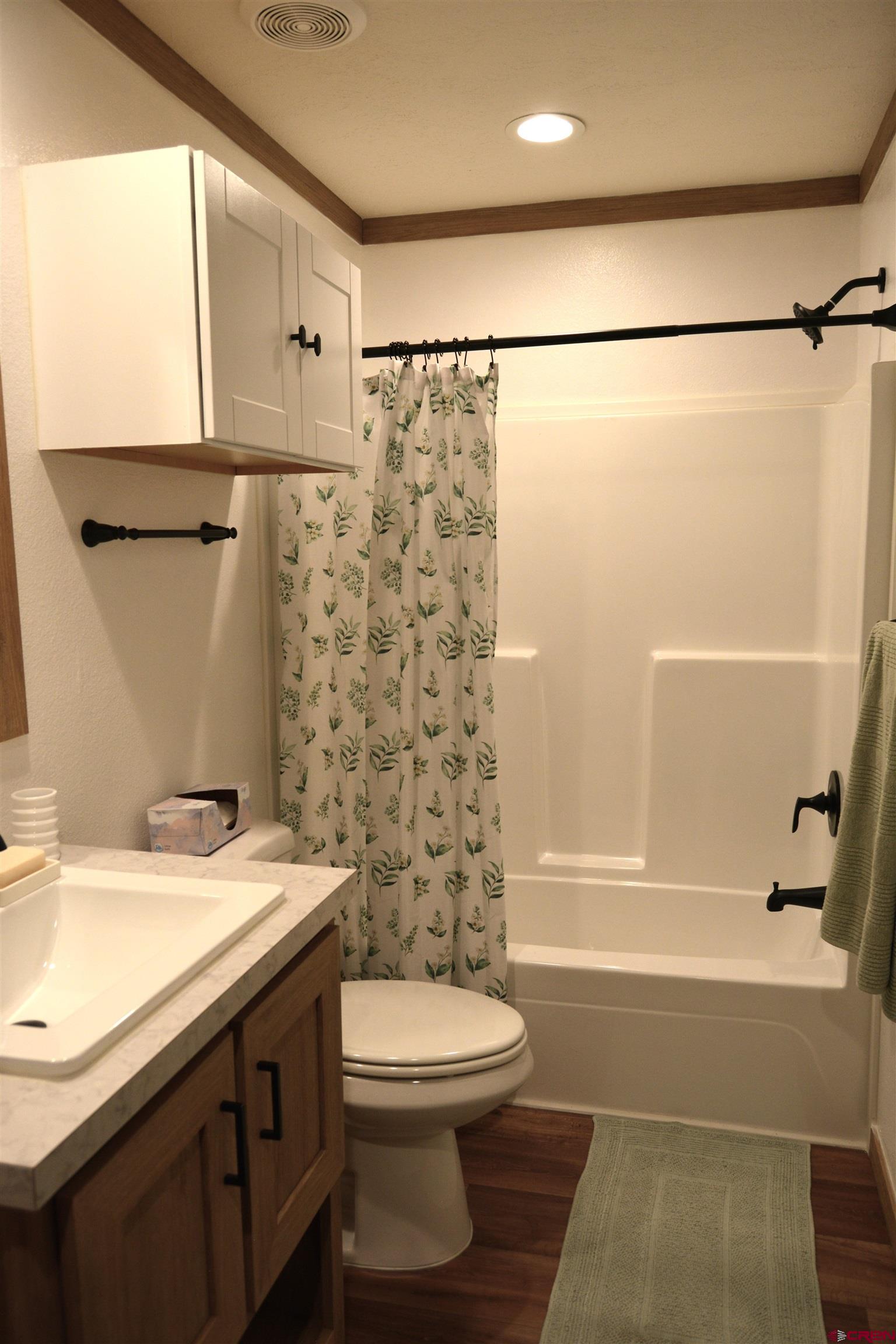 901 6530 Road, Unit 1030 Montrose, CO 81401 - Photo 17 of 22 a bathroom with a sink and a mirror