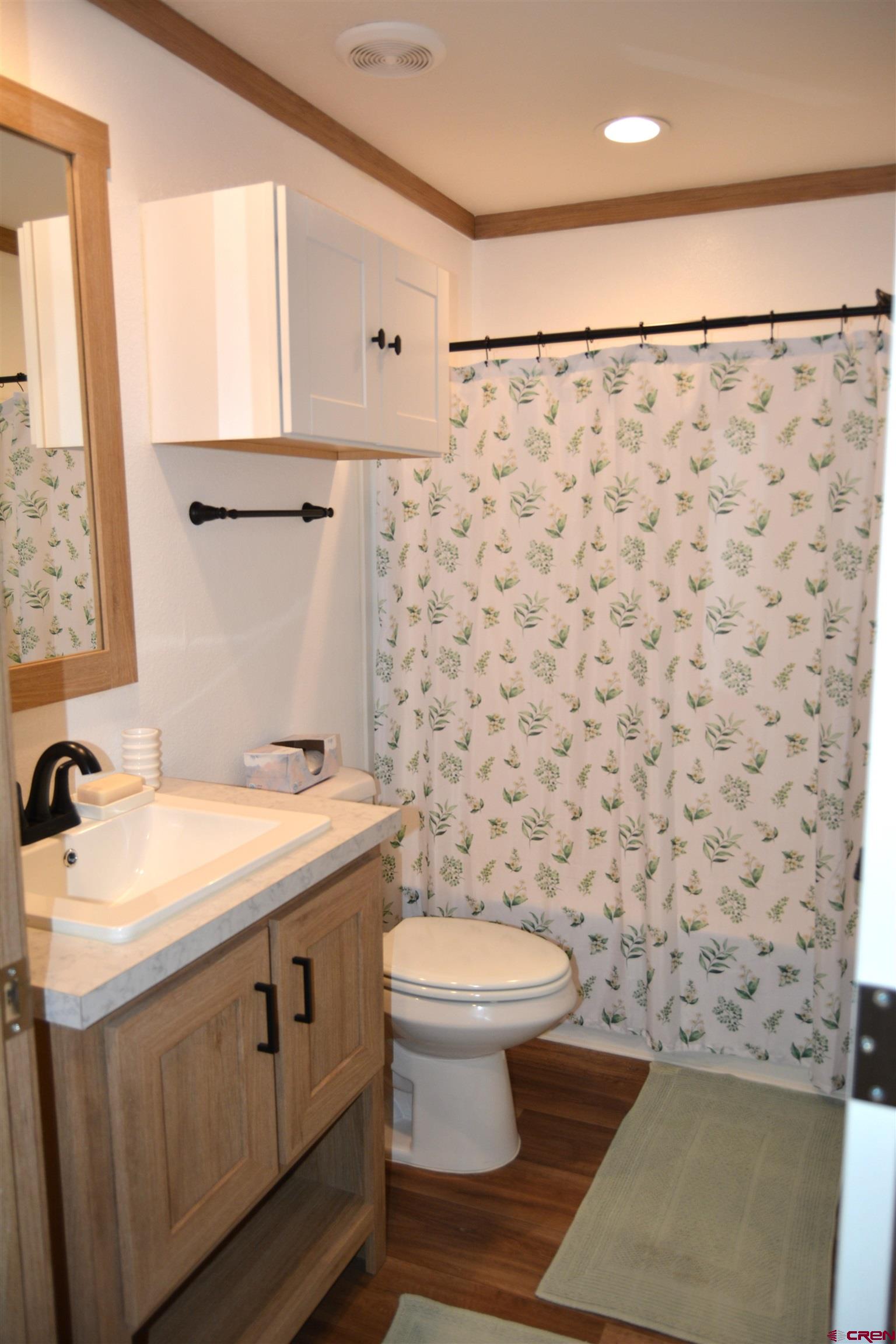 901 6530 Road, Unit 1030 Montrose, CO 81401 - Photo 18 of 22 a bathroom with a sink toilet and shower