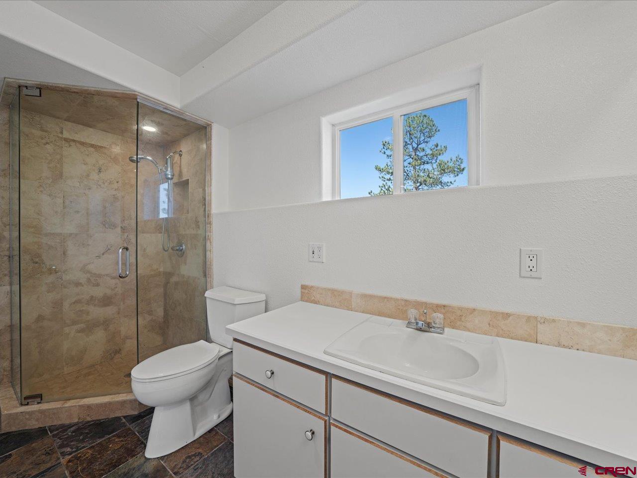 55 Valley View Road Ridgway, CO 81432 - Photo 17 of 40 a bathroom with a sink a toilet and shower