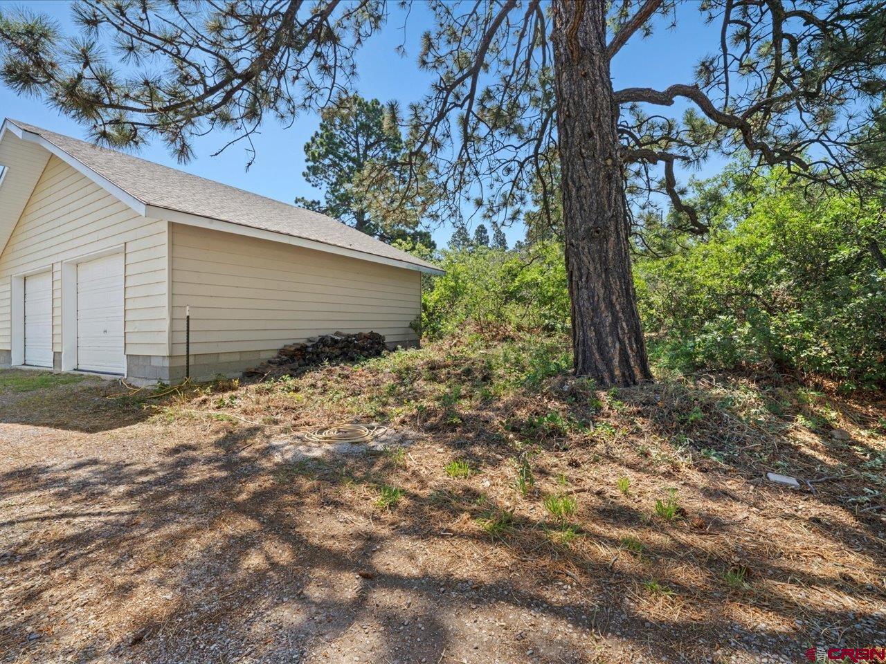 55 Valley View Road Ridgway, CO 81432 - Photo 34 of 40 a backyard of a house with lots of green space