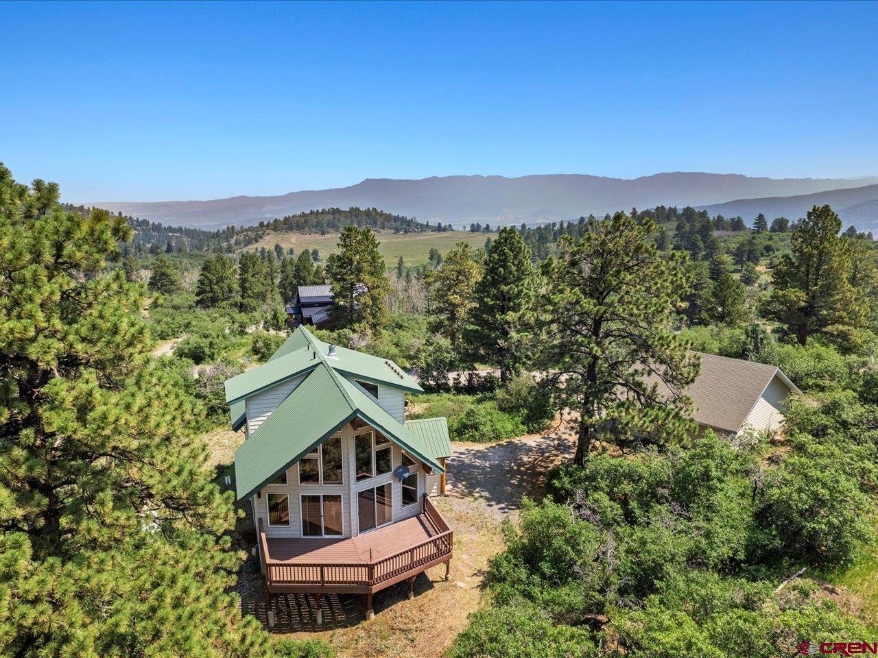 55 Valley View Road Ridgway, CO 81432 - Photo 38 of 40 a view of a house with a mountain in the background