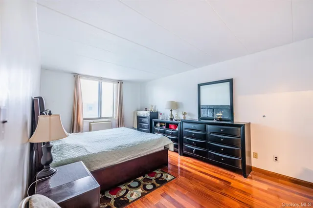 a bed room with a bed and window