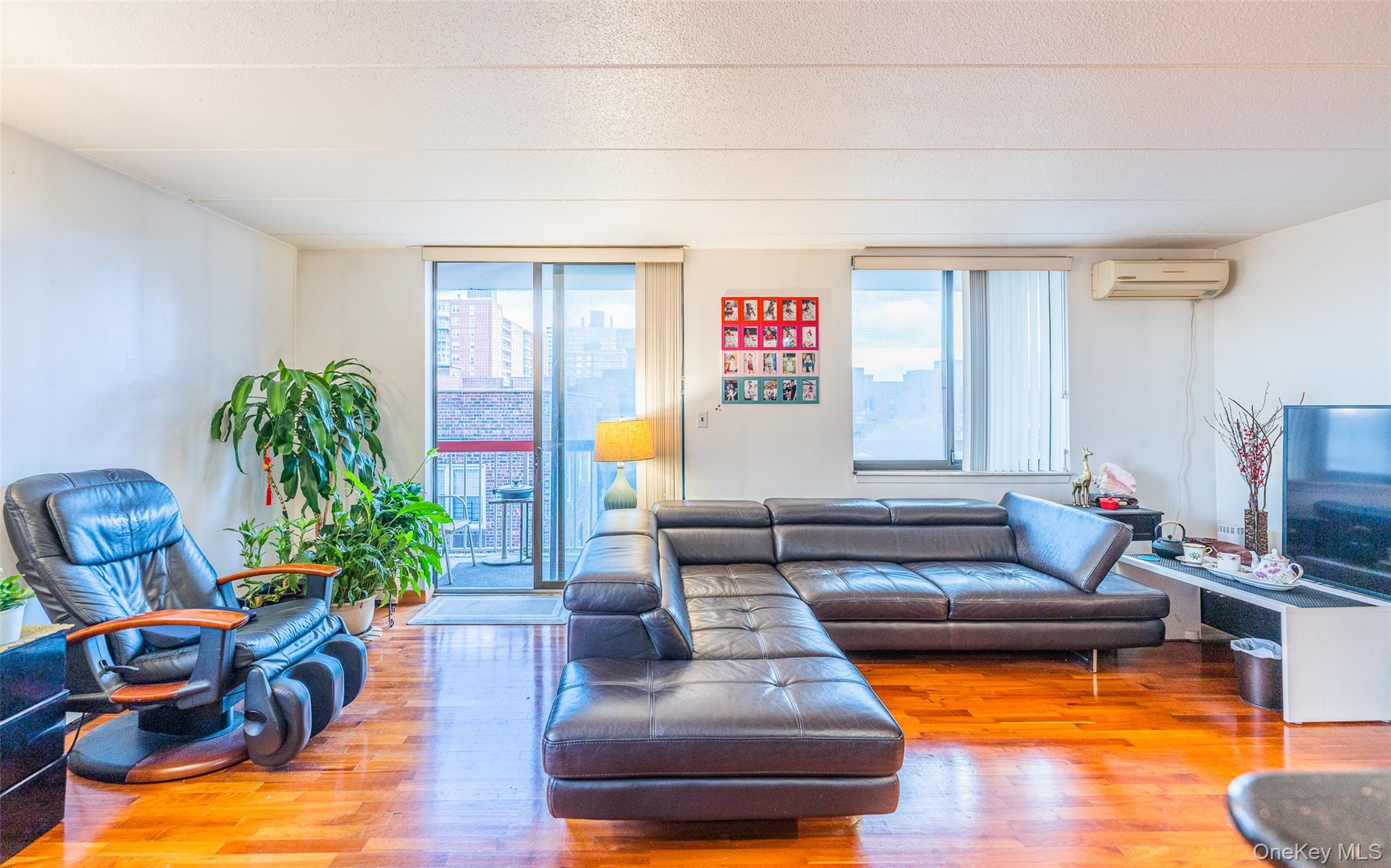 136-24 Maple Avenue, Unit 6F Queens, NY 11355 - Photo 6 of 29 a living room with furniture and a couch