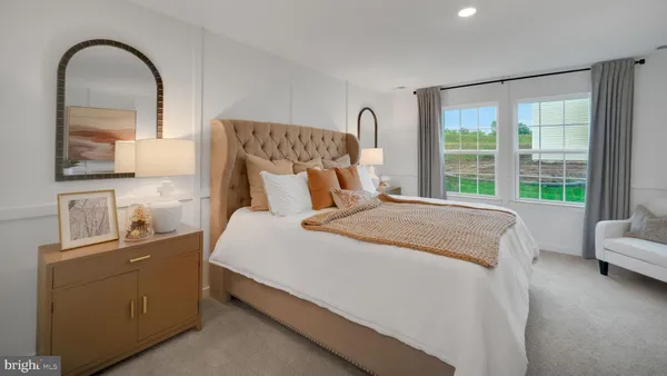 a bedroom with bed and a window