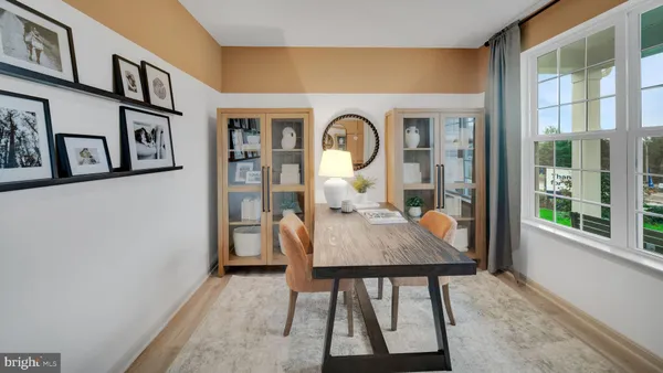 a view of a dining room with furniture and window