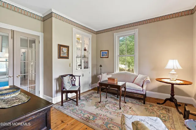 a view of staircase with railing and a window