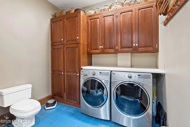 a view of a house with brick walls and flower plants