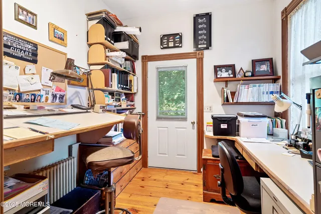 a view of a terrace with lawn chairs