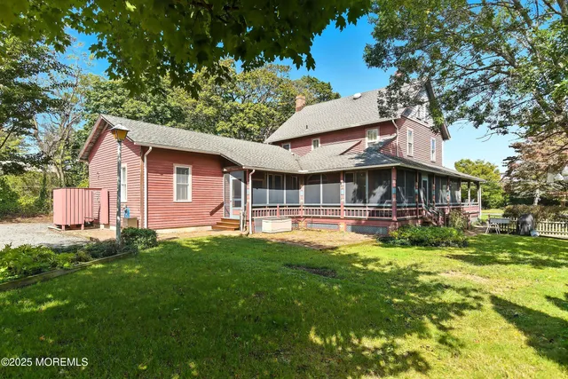 a living room with furniture and entry gate
