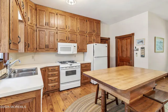 a view of swimming pool with a garden and plants
