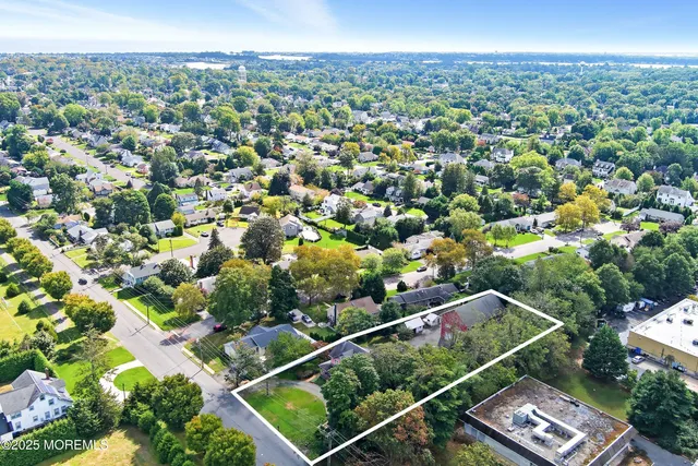 a view of entryway with wooden floor and livingroom